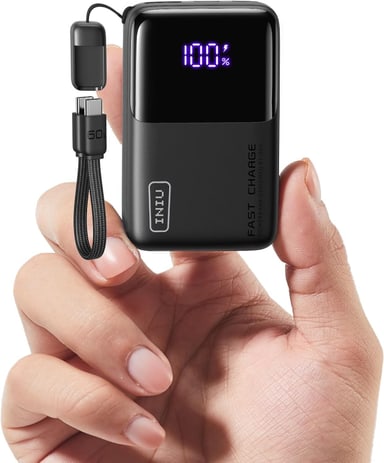 INIU Pocket Rocket P50 power bank with digital display held in a hand
