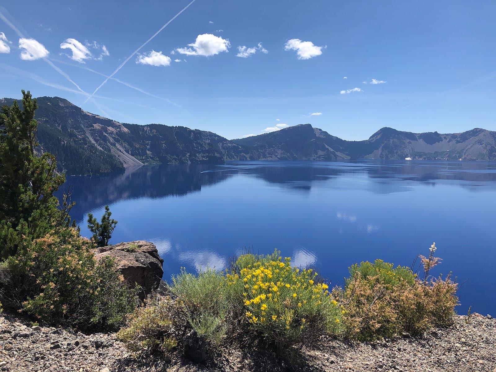 A broad blue view of Crater Lake from the caldera rim