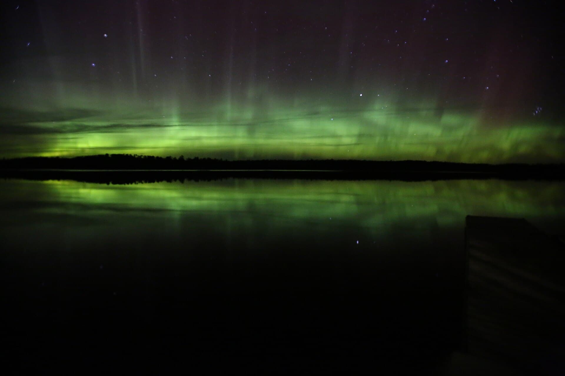 Northern lights glowing over Voyageurs National Park