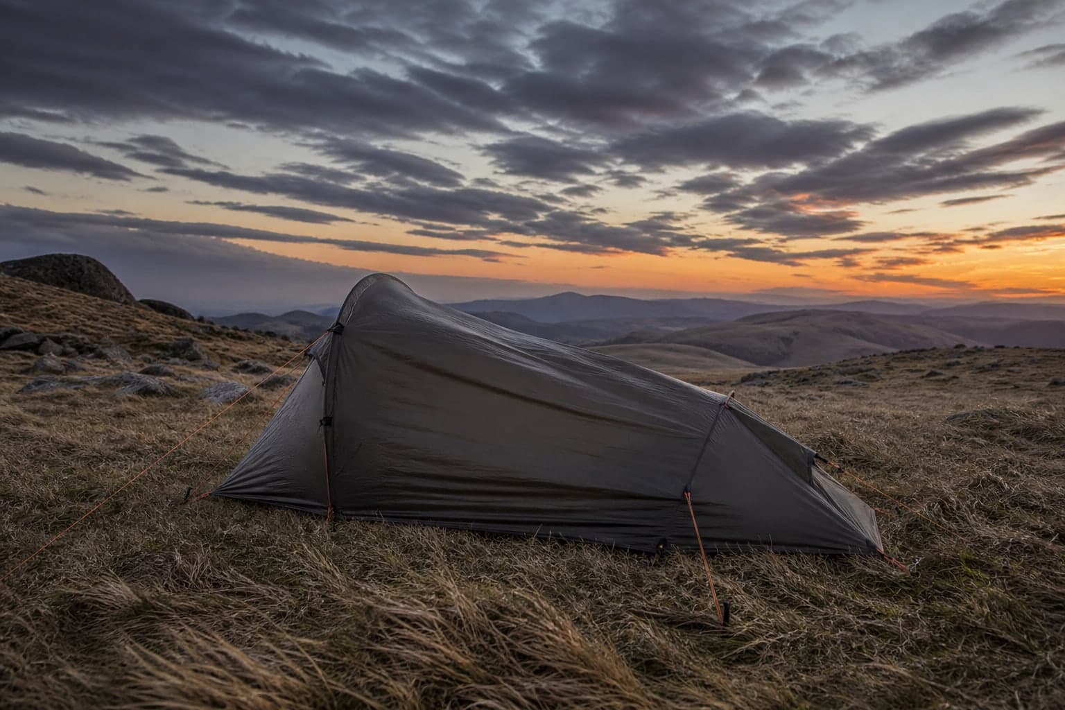 A tent pole and rainfly system designed for windy conditions