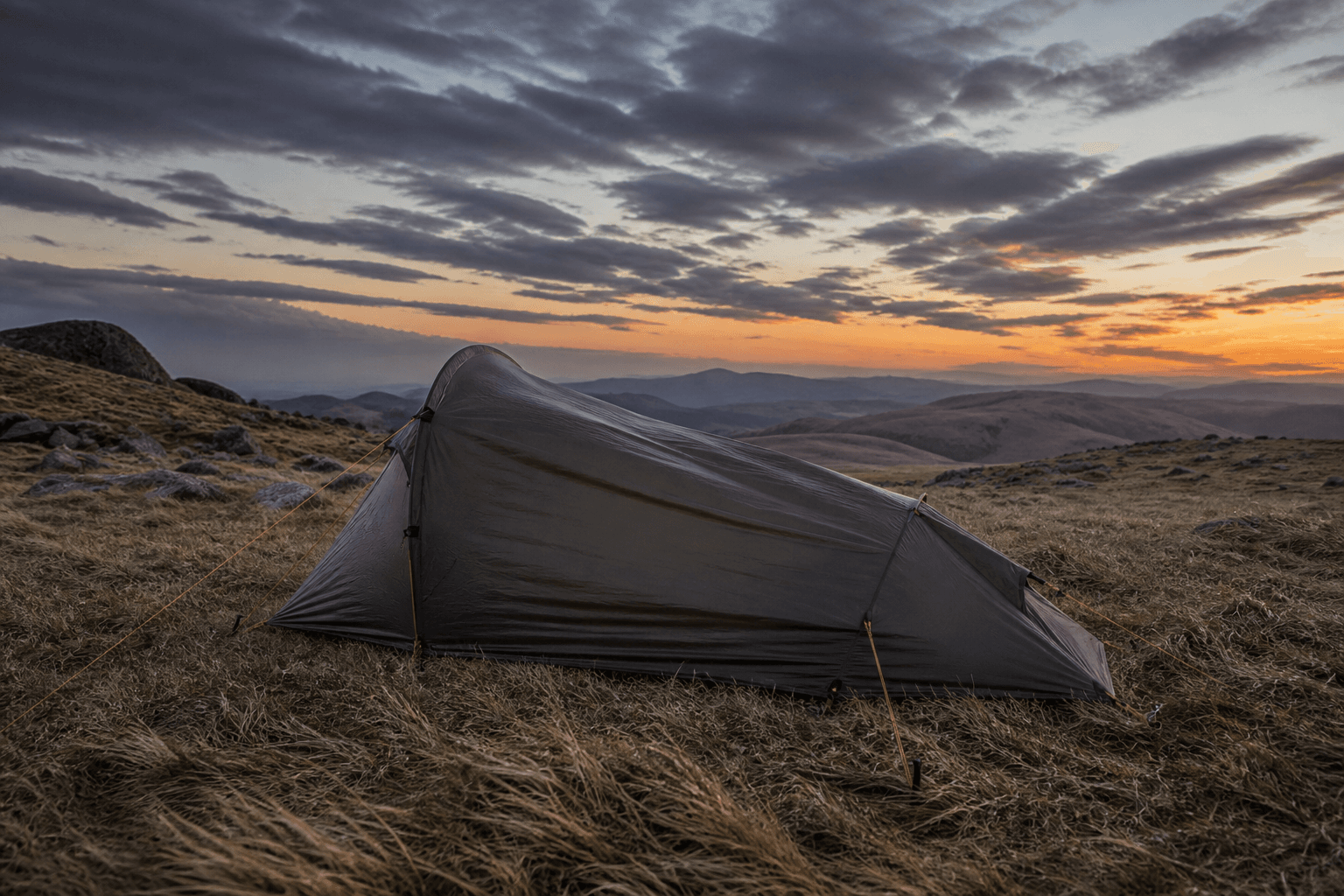 A tent pole and rainfly system designed for windy conditions