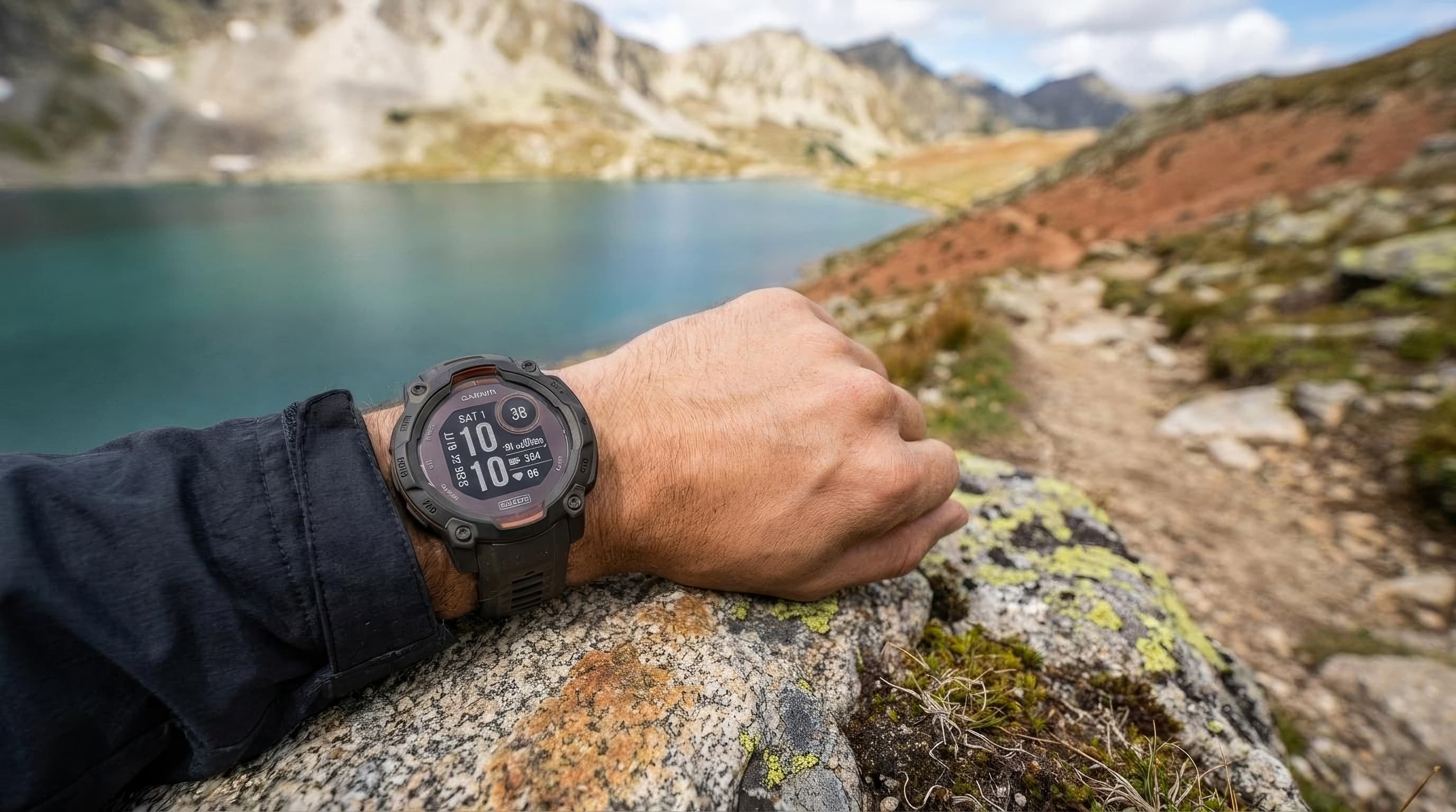 Garmin Instinct 3 Solar 45mm watch shown against a rugged hiking backdrop