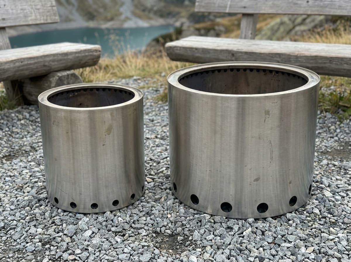 Illustration of two empty stainless-steel fire pits with different footprints