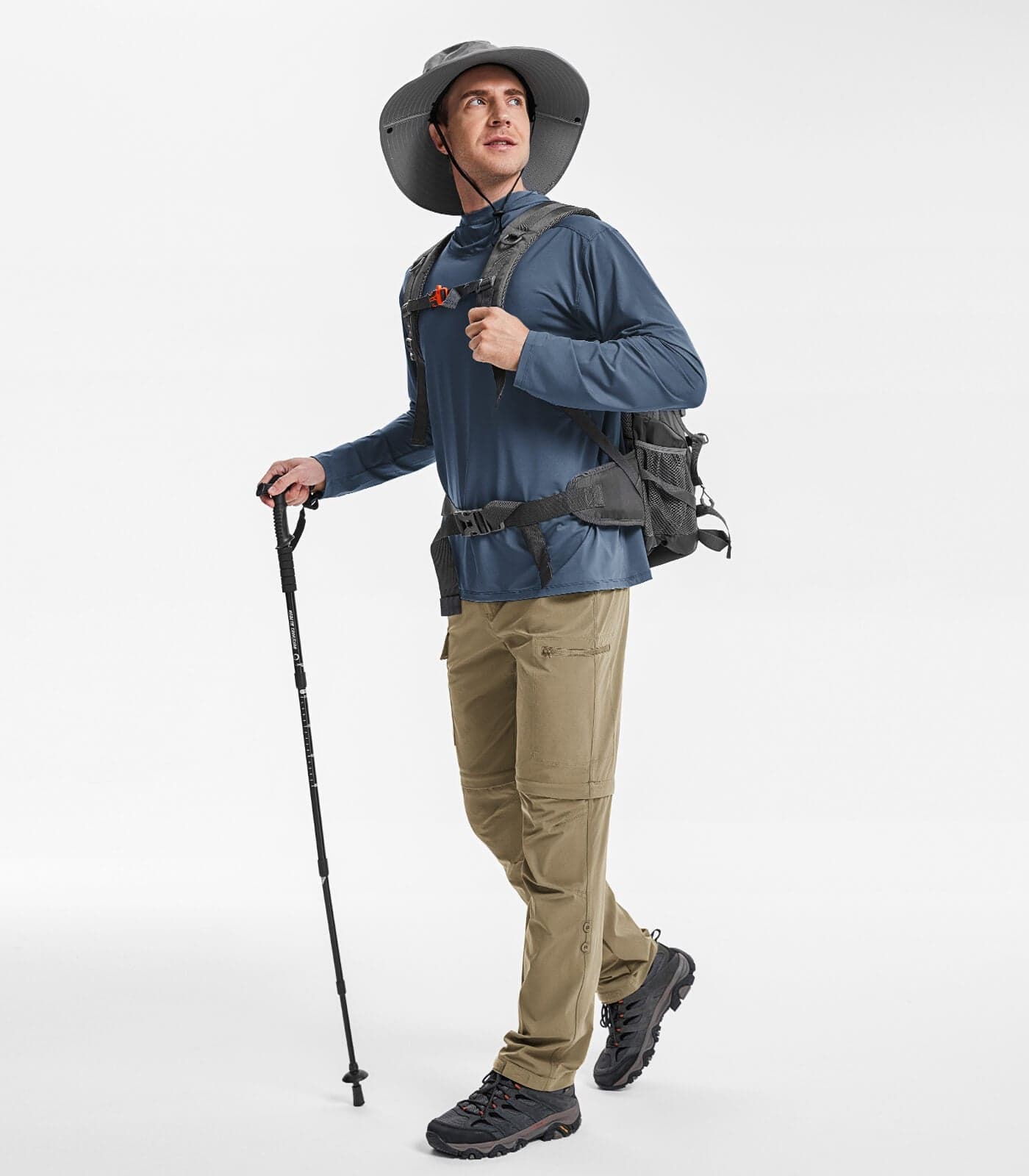 A hiker wearing Moosehill HikerFlex M015 convertible pants with the legs attached