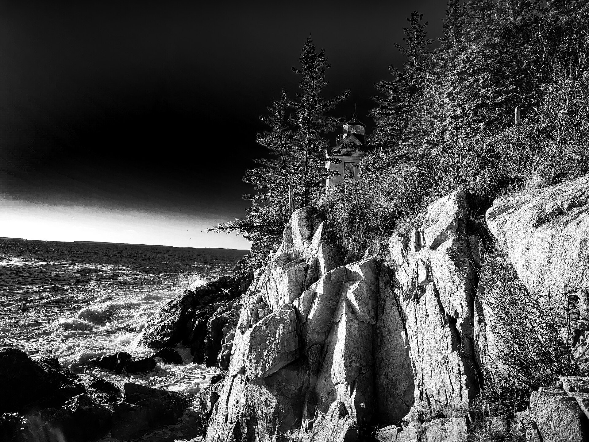 Bass Harbor Head Light above the rocky Acadia shoreline