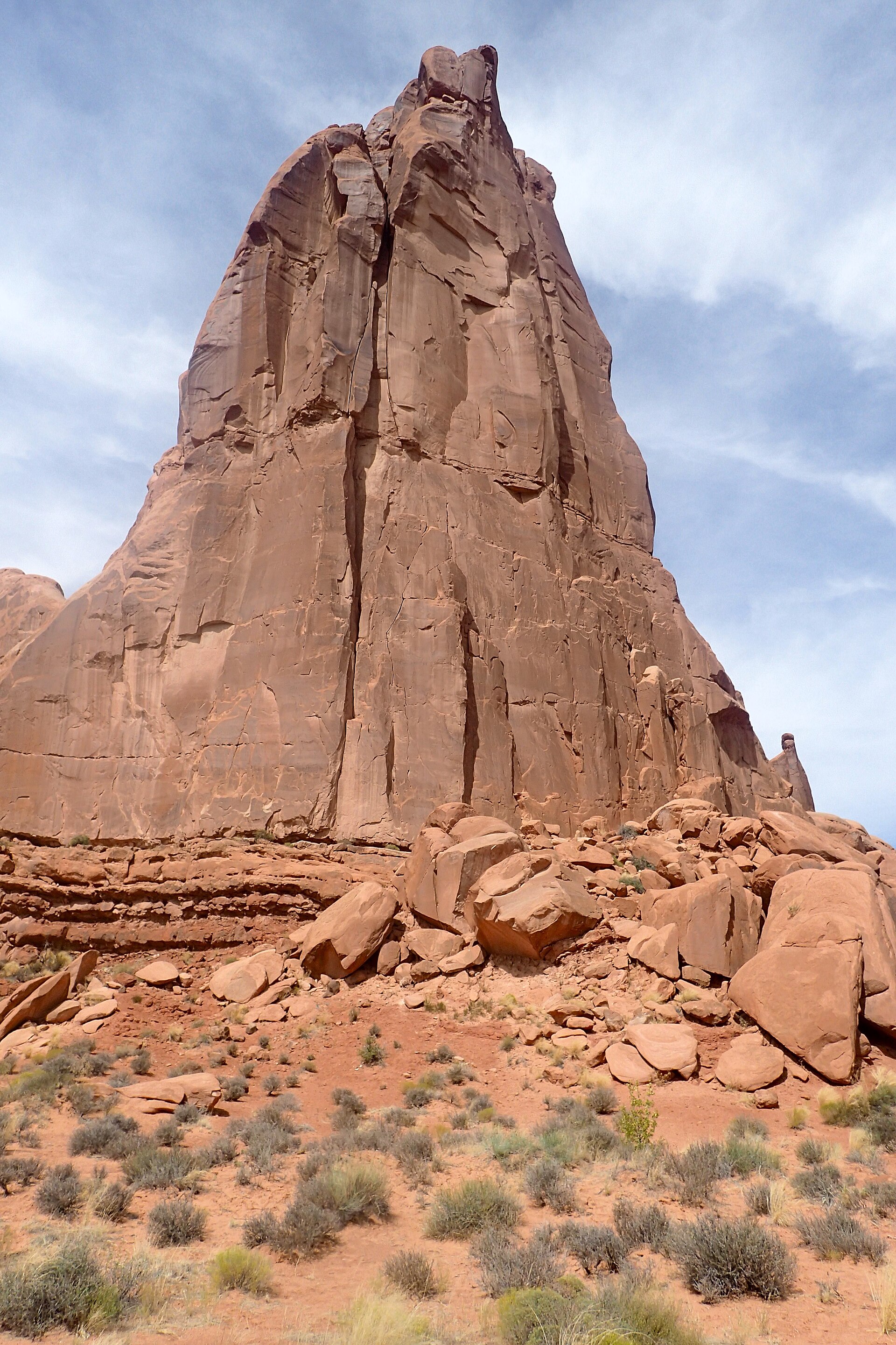 The Park Avenue canyon walls rising beside the scenic drive in Arches