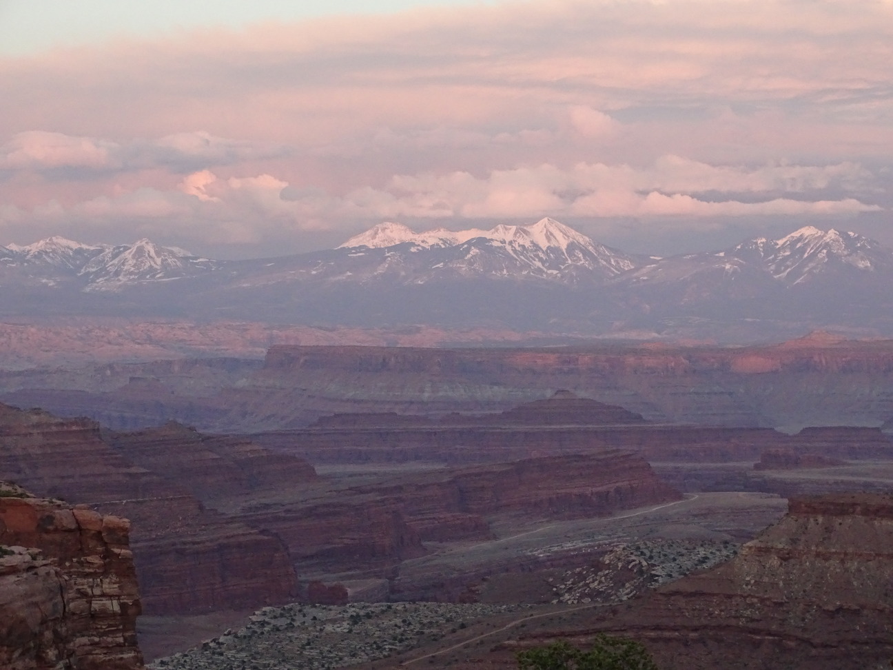 Shafer Canyon glowing at sunset below Island in the Sky