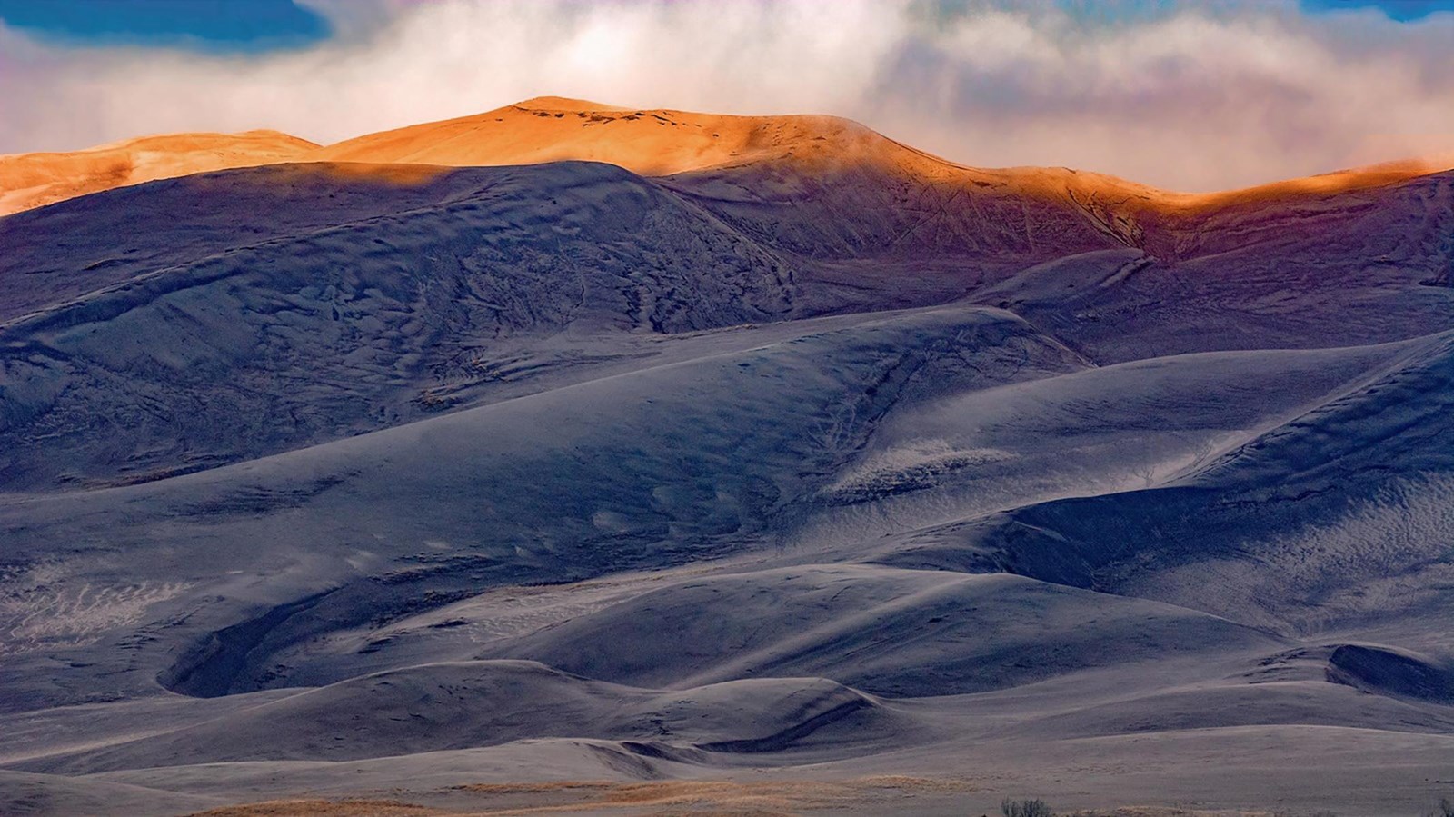 Hikers climbing High Dune above the main dune field