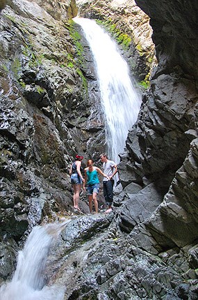 Zapata Falls dropping through a narrow rocky cleft