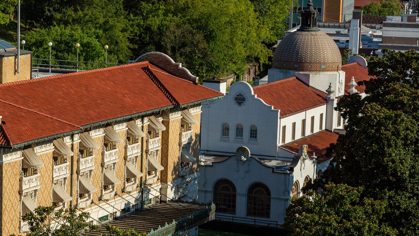 Bathhouse Row and downtown Hot Springs seen from above at golden hour