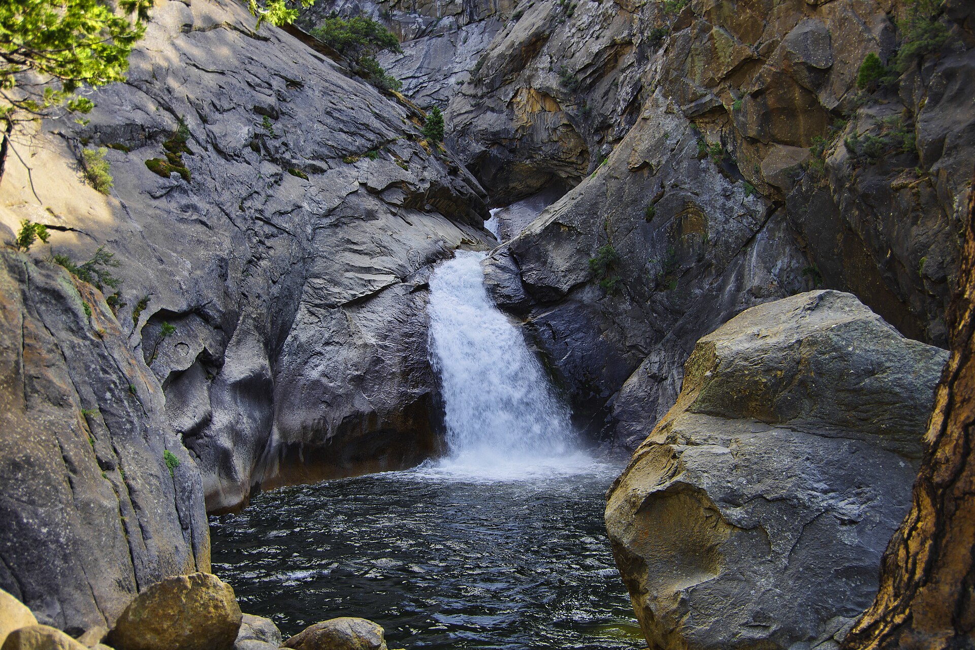 Roaring River Falls pouring into a shaded pool