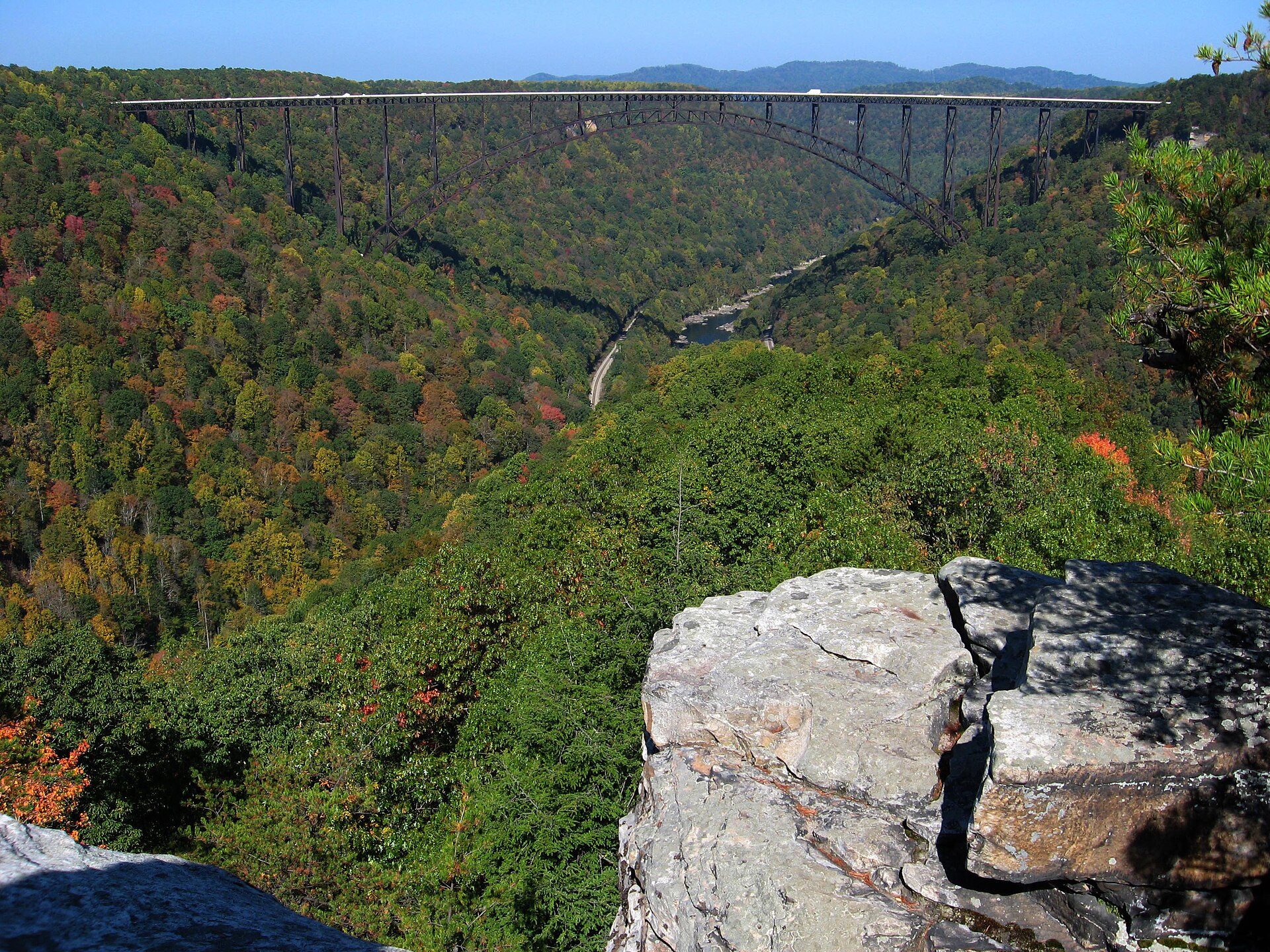 The New River Gorge Bridge framed from the Long Point Trail overlook