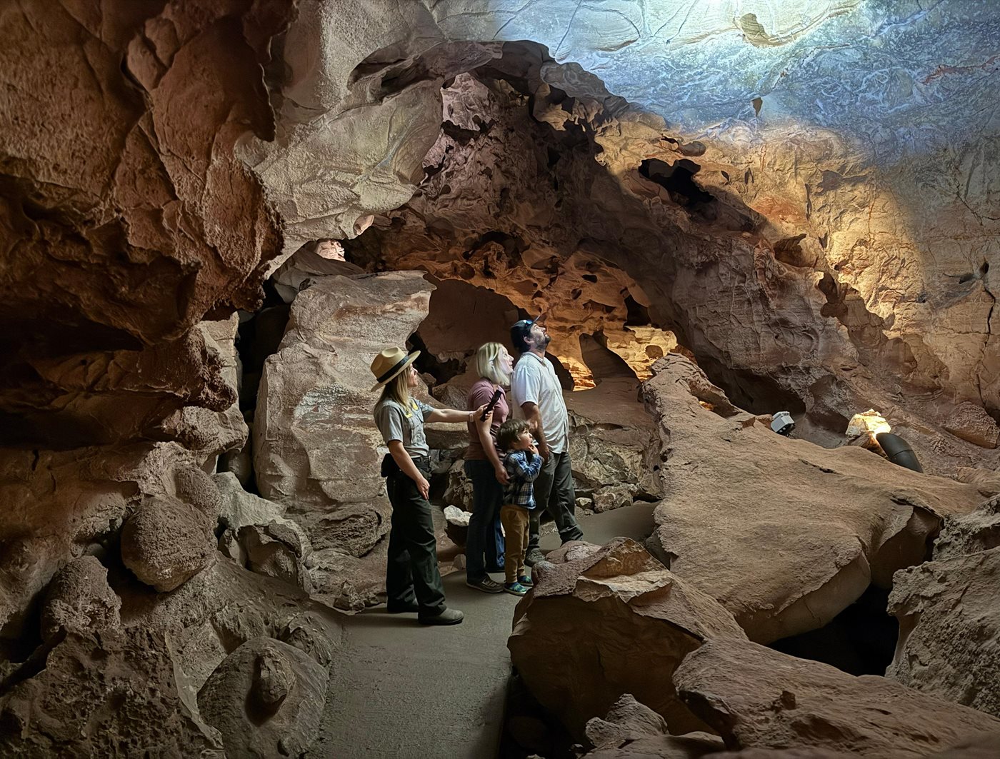A ranger showing visitors formations inside Wind Cave