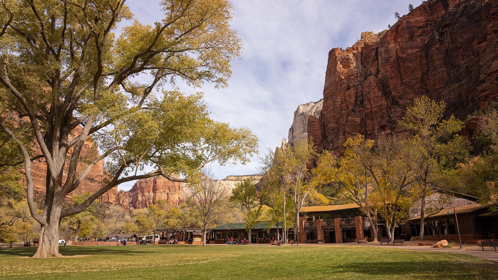 Zion Lodge with canyon walls rising behind it