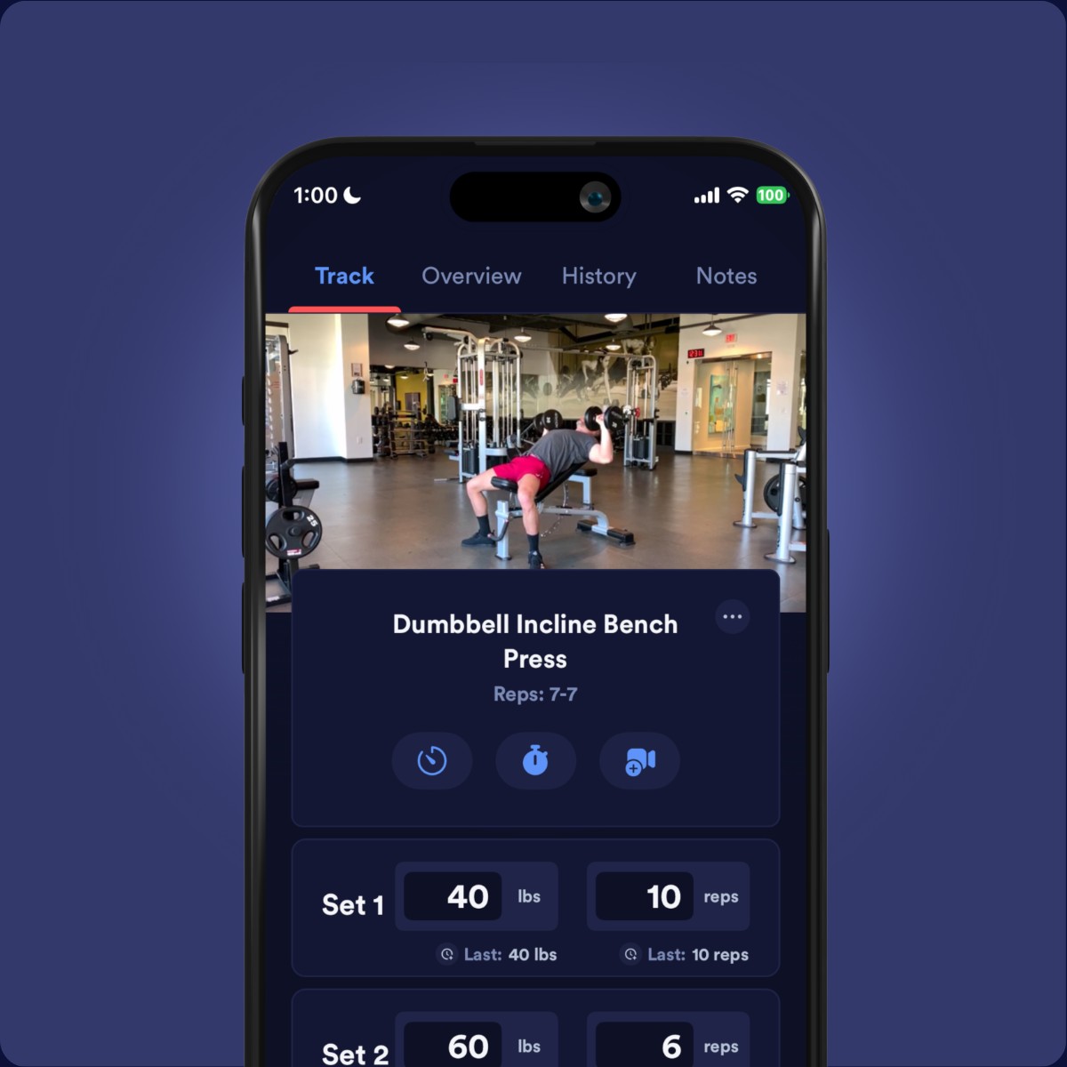 Caliber workout tracker showing an incline dumbbell press, set targets, and previous weights on a phone screen